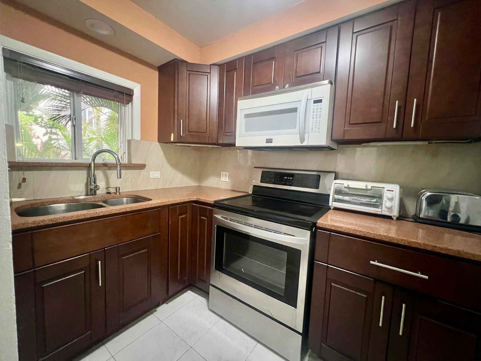 Furnished 2BR Condo for sale in Jolly Harbour, Antigua - TV Kitchen Area