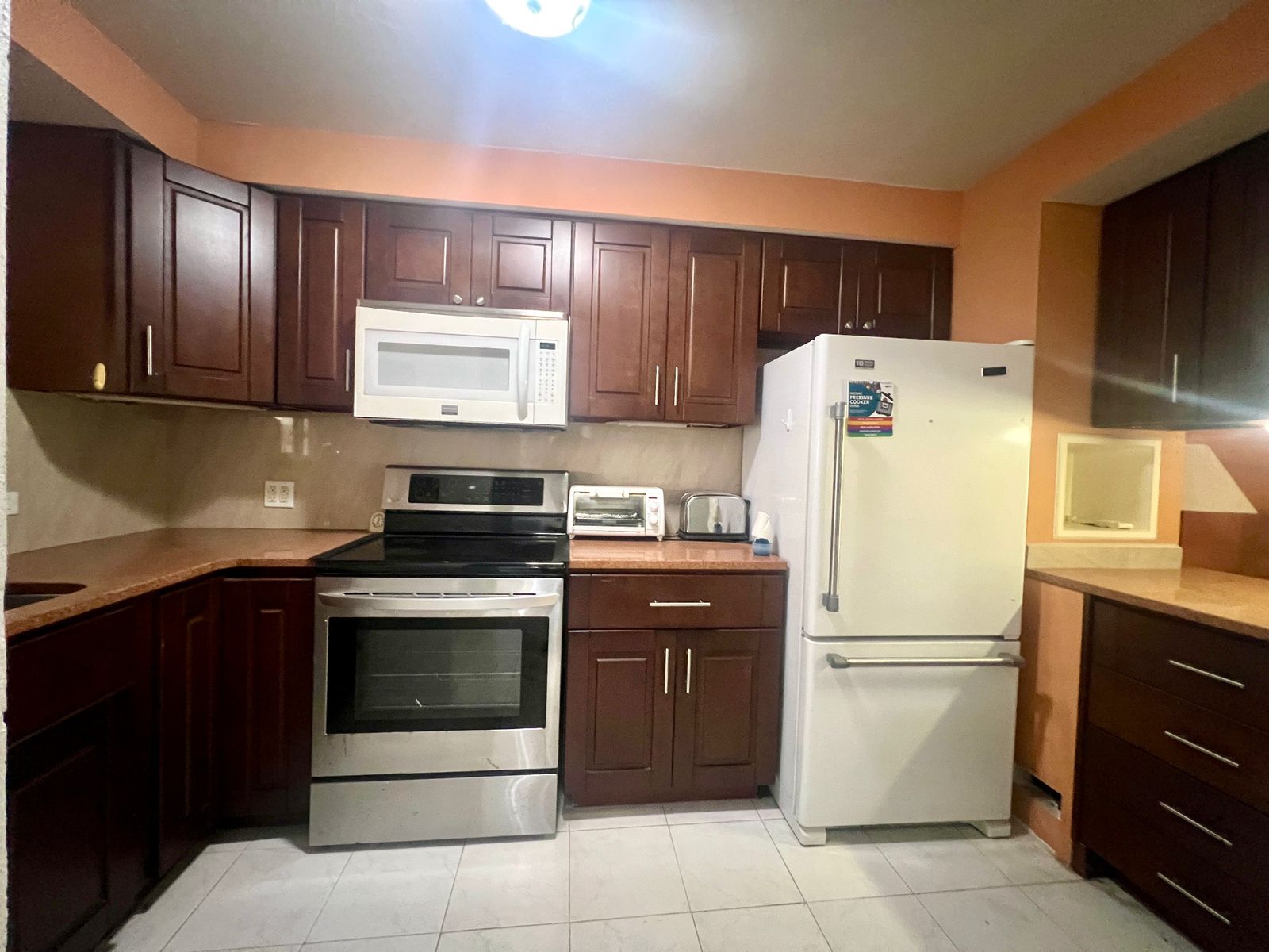Furnished 2BR Condo for sale in Jolly Harbour, Antigua - TV Kitchen