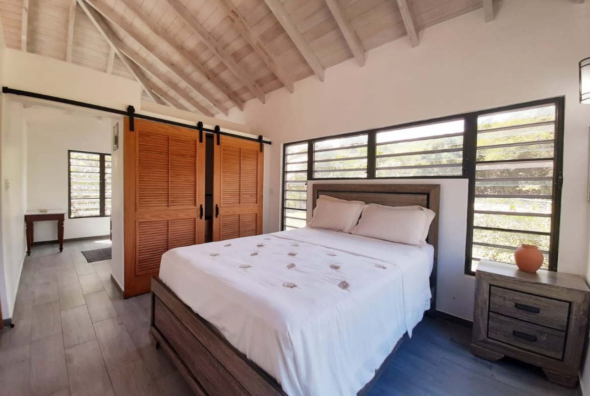 Cozy bedroom with natural light and elegant furnishings