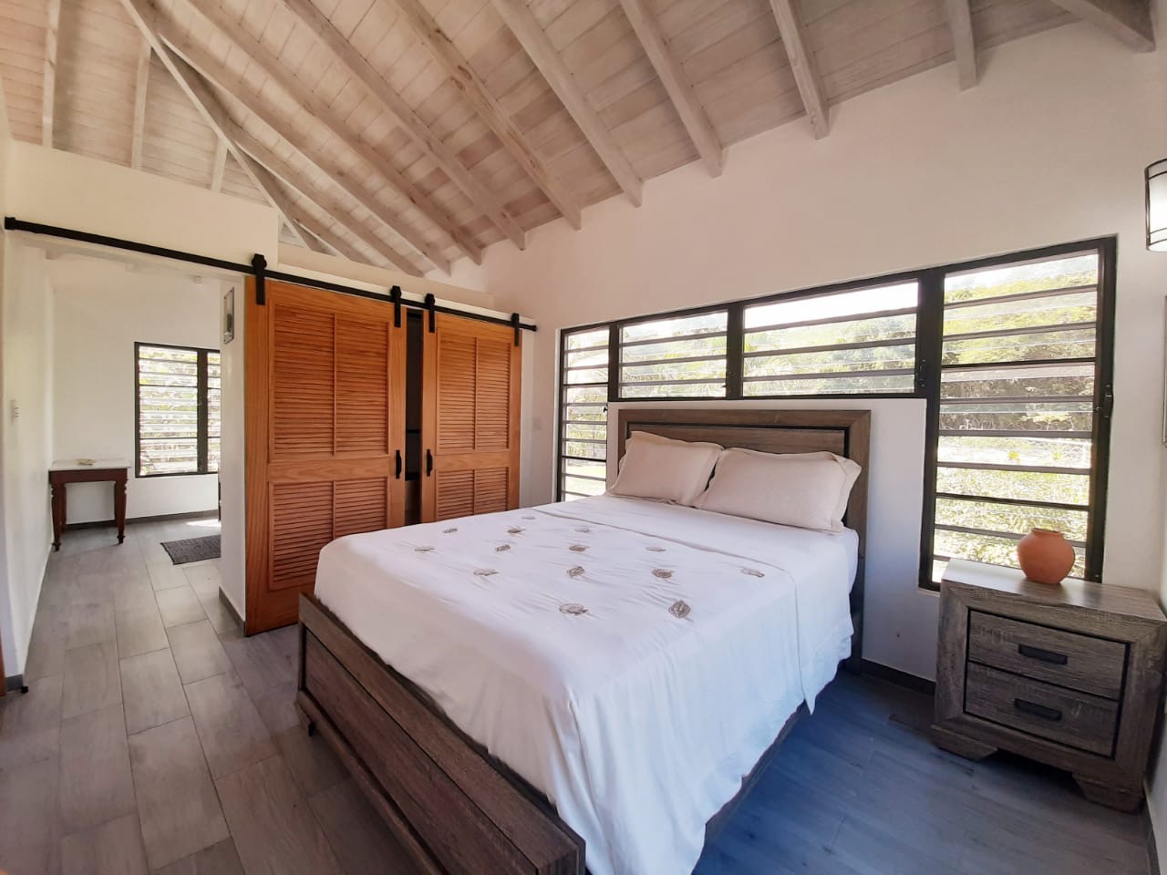 Cozy bedroom with natural light and elegant furnishings