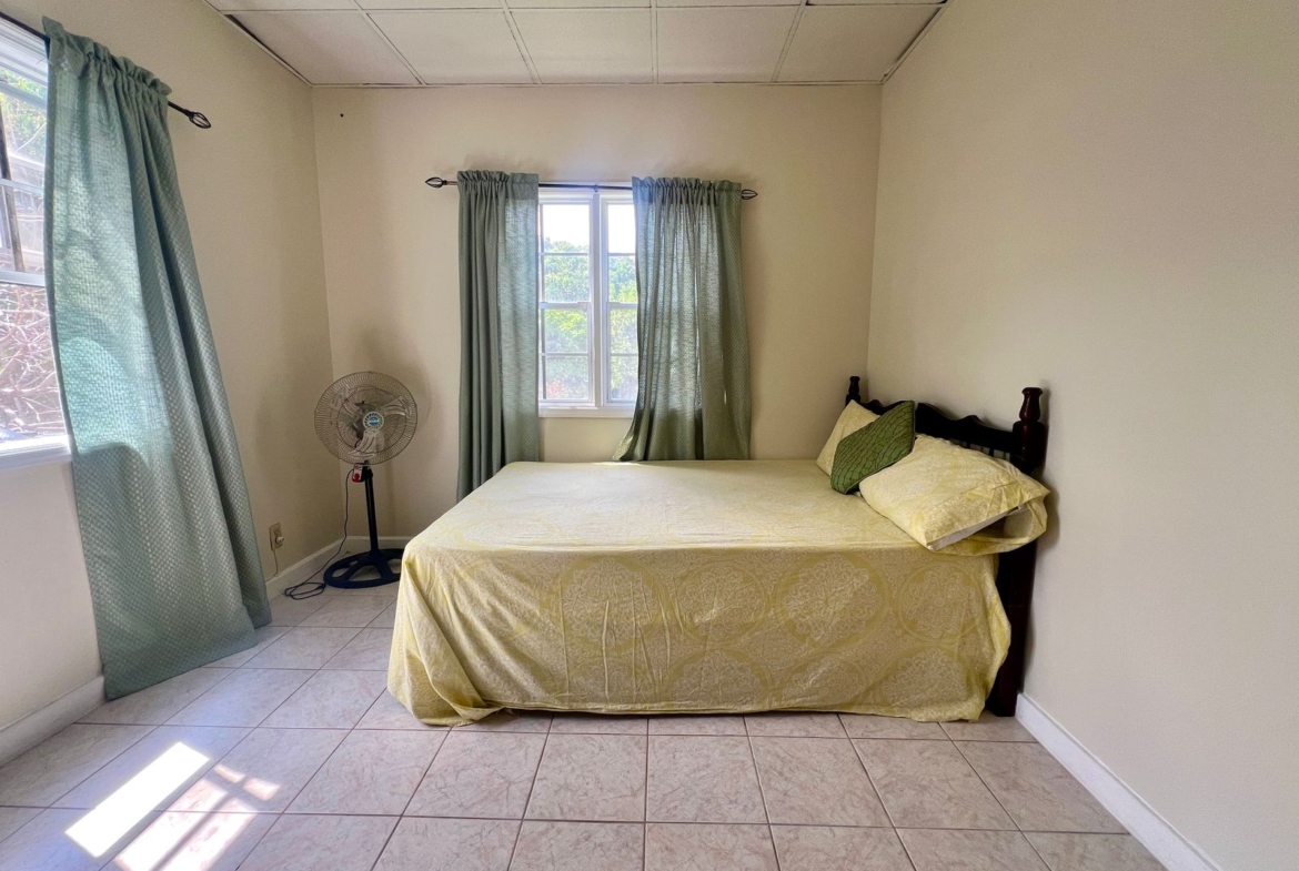 bedroom at Emerald Breeze Cottage.