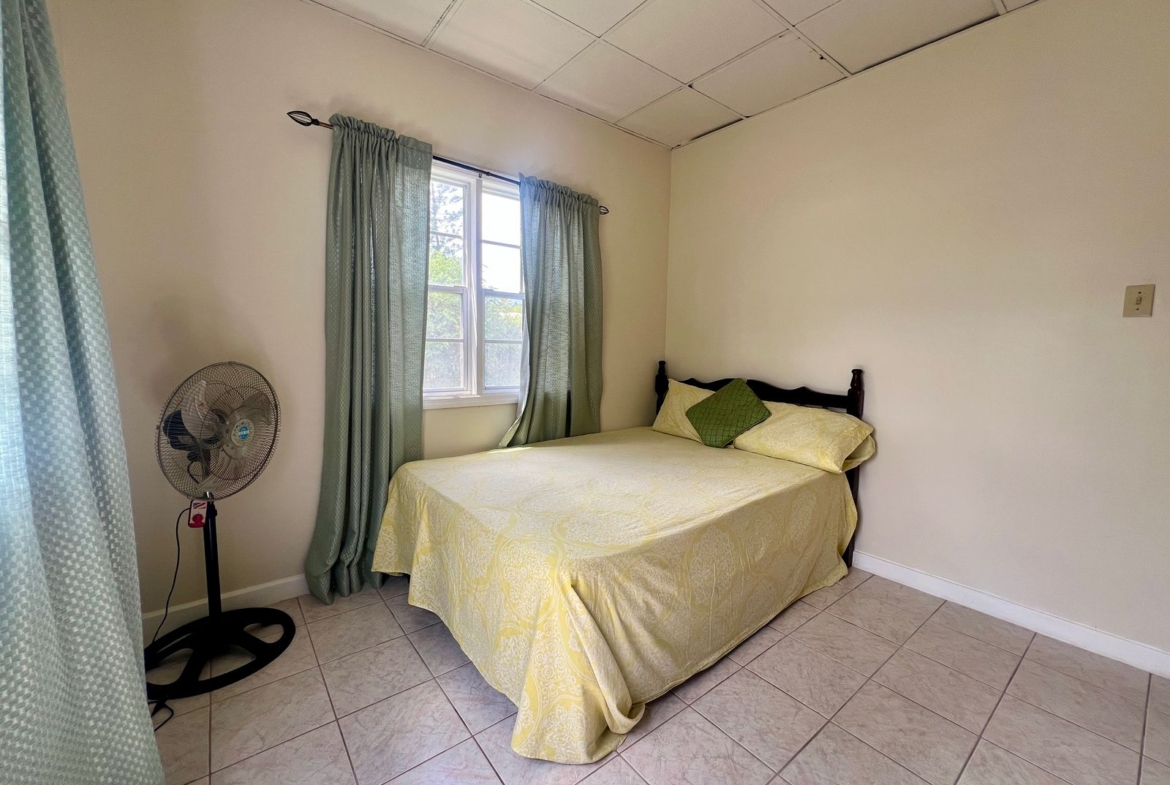 Beautiful bedroom at Emerald Breeze Cottage.