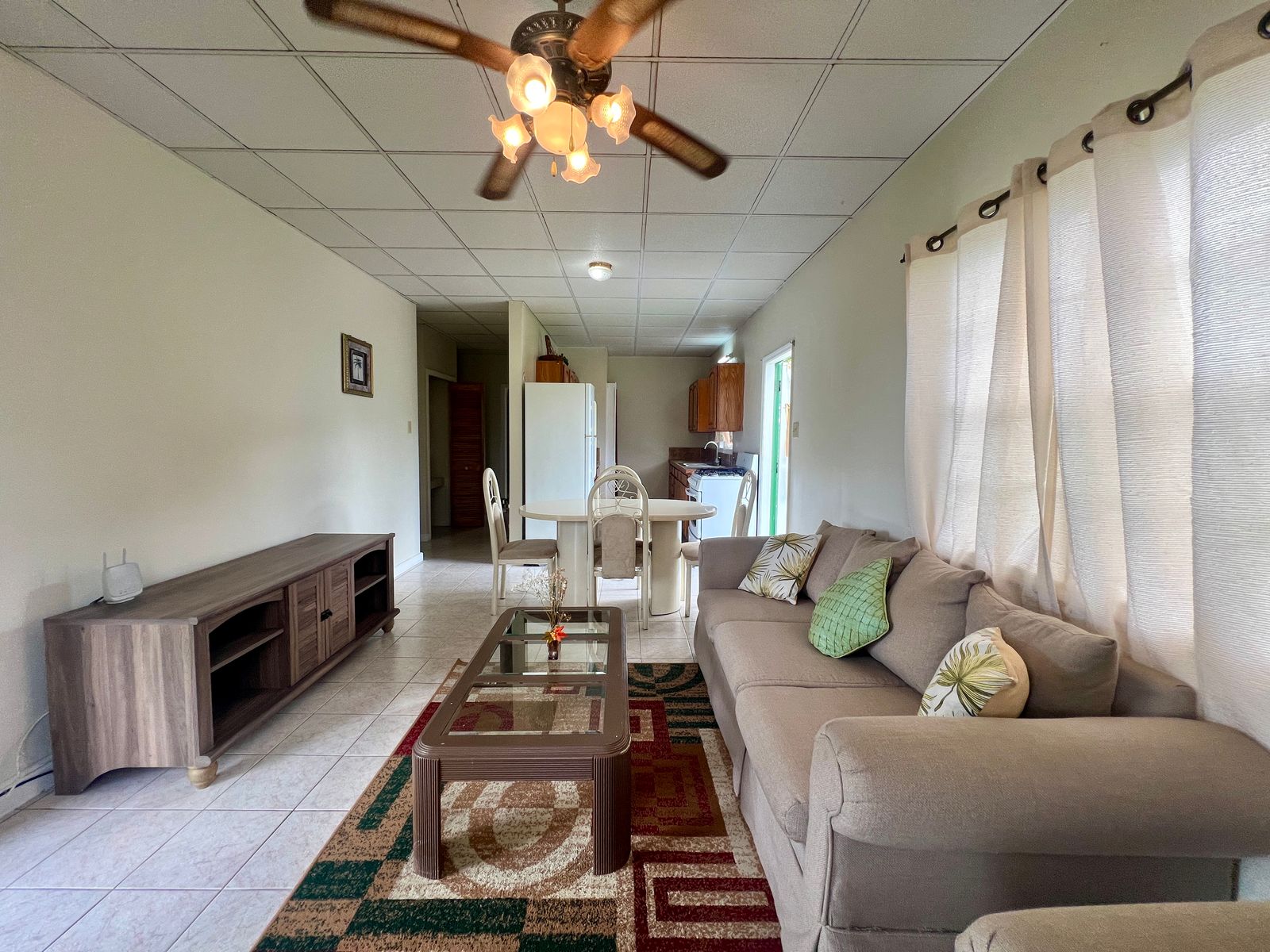 Open-concept living and dining area in Emerald Breeze Cottage.