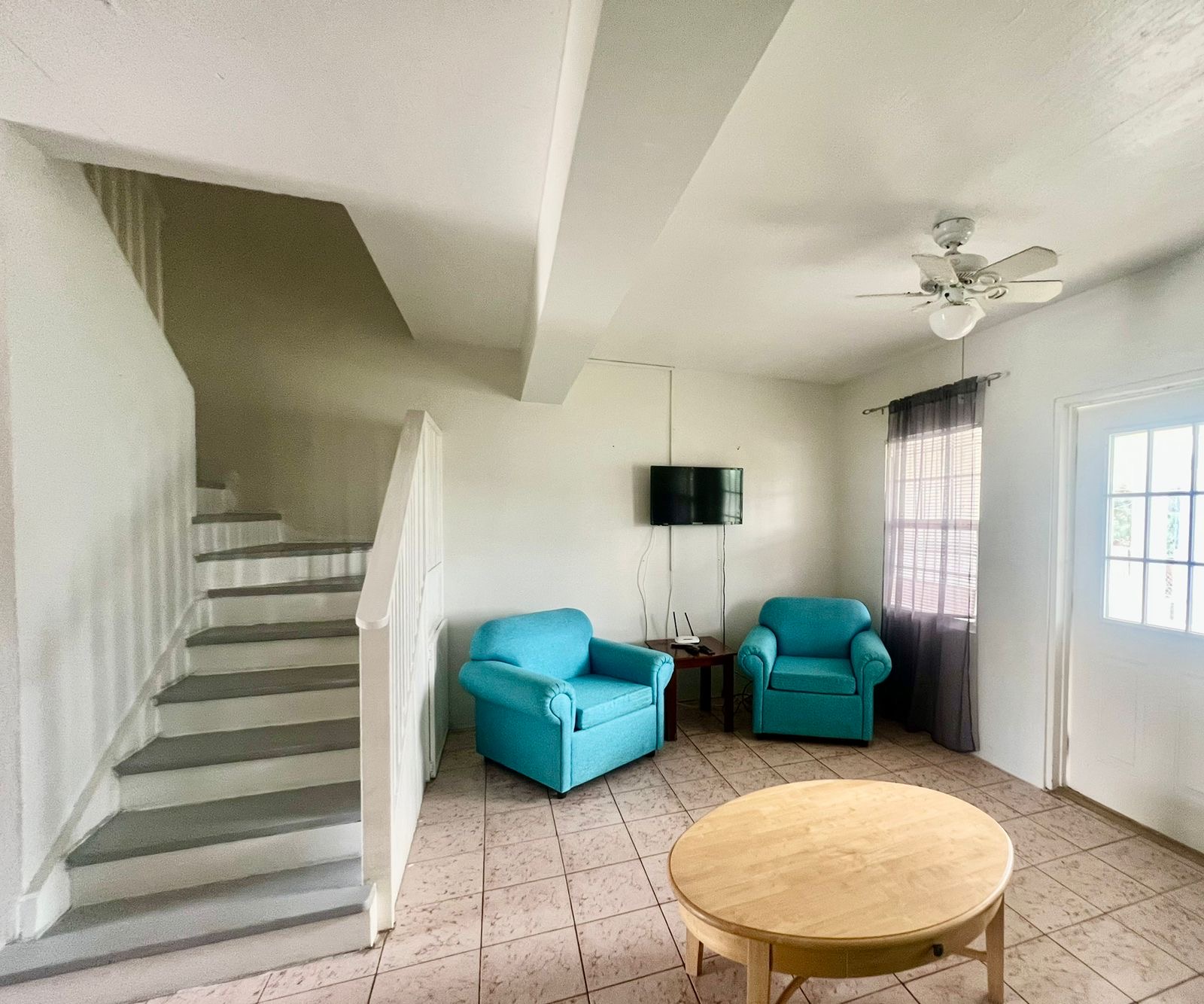 Semi-Furnished Apartment for Rent in Antigua with Spacious Living Room inside staircase