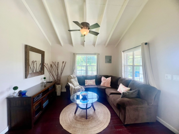 Living room with flat-screen TV and inverter A/C in Royal Gardens cottage, Antigua